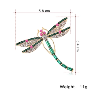 Elegant rhinestone dragonfly brooch in gold finish with green crystals, 5.8cm x 5.4cm size