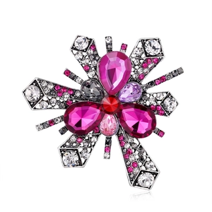 Vintage silver floral brooch with large purple gemstones and sparkling rhinestone accents