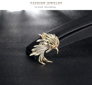 Close-up of the back structure and pin clasp on a golden phoenix tail brooch