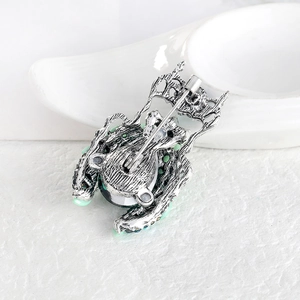 Vintage beetle brooch with green rhinestones and antique silver finish back view