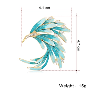 Elegant gold phoenix brooch with blue enamel and rhinestones, size 4.1 cm by 4.7 cm