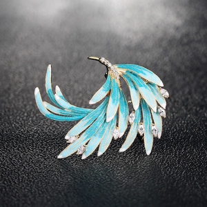 Elegant gold-plated phoenix feather brooch with blue enamel and sparkling zircon stones