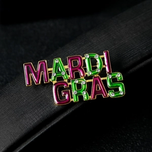 Gold-plated Mardi Gras letter brooch with purple and green enamel and crystal accents