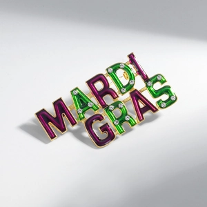Sparkling Mardi Gras letter brooch in purple and green enamel with golden plating