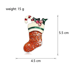 Christmas stocking brooch with candy cane and red berry details for holiday jackets