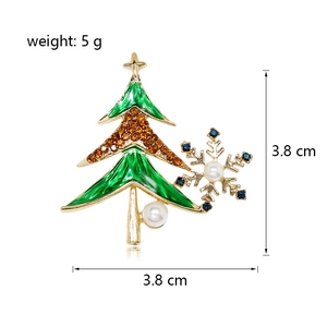 Christmas tree brooch with green enamel, orange rhinestones and blue snowflake pearl accents