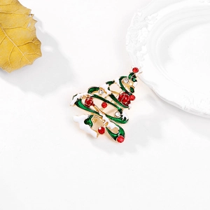 Broche sapin de Noël émaillée verte avec strass brillants et base dorée élégante