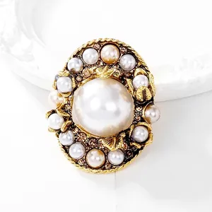 Baroque retro pearl brooch with rhinestones and vintage gold finish for elegant suits