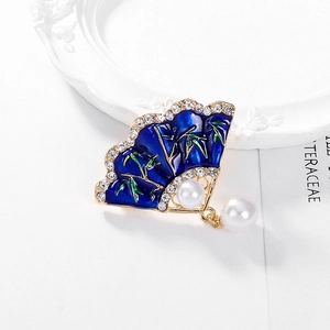 Elegant fan-shaped brooch with blue enamel bamboo pattern, pearls, and crystals