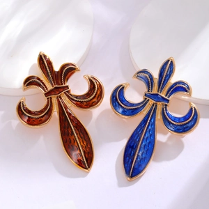 Vintage palace lily brooches in sapphire blue and amber enamel with golden metal frame