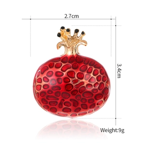 Red enamel pomegranate brooch with golden crown detail and dimensions 2.7x3.4cm