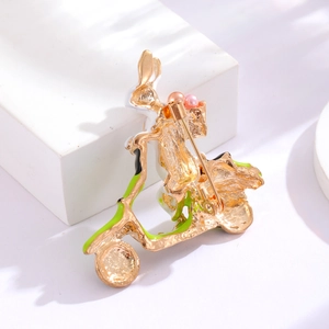 Cute enamel rabbit riding scooter brooch with colorful beads on white platform