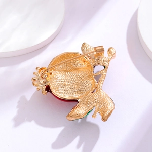 Minimalist pomegranate brooch pin in gold-plated alloy with red and green enamel details
