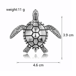 Retro turtle brooch in silver metal with textured shell and punk style turtle pin