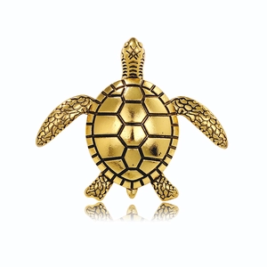 Detailed close-up of a vintage gold turtle brooch with intricate scale textures