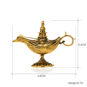 Vintage exotic Aladdin lamp brooch in retro gold finish with intricate embossed detailing