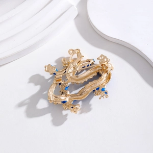 Broche dragon doré de style chinois avec émail bleu et fermoir à épingle au dos