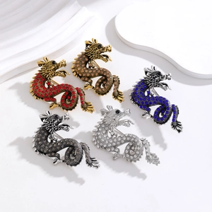 Dragon brooches with rhinestones in red, gold, blue, silver and gunmetal finish