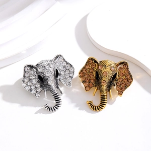Vintage olifant broche set met sprankelende strassteentjes in goud en zilver