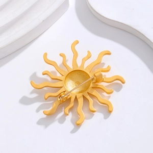 Matte gold sunflower brooch with vintage sun shape and secure rotating lock pin detail