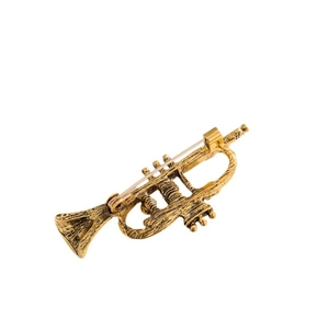 Vintage golden trumpet brooch with antique finish and secure pin clasp on white background
