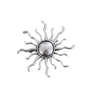 Vintage silver sunburst brooch with antique metal texture and sixteen wavy rays