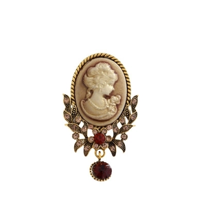 Vintage Victorian style cameo brooch with red gemstone pendant and gold trim details