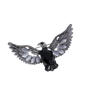Vintage silver eagle brooch with black faceted gemstone and grey cat-eye stones wings