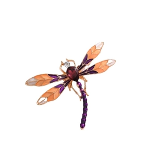 Elegant dragonfly brooch with purple and orange enamel wings and crystal inlay