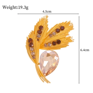 Golden wheat stalk brooch with champagne rhinestones and pear-shaped amber gem