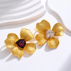 Vintage style matte gold flower earrings with large purple and champagne crystals