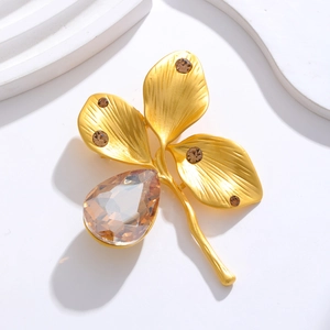 Vintage gold clover brooch with champagne teardrop crystal and brown rhinestones