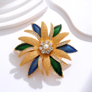 Vintage flower brooch with blue and green enamel petals, pearls and crystals decoration