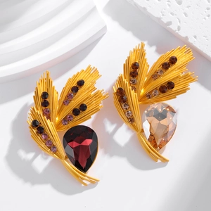 Vintage gold wheat leaf earrings with large pear-cut burgundy and champagne gemstones