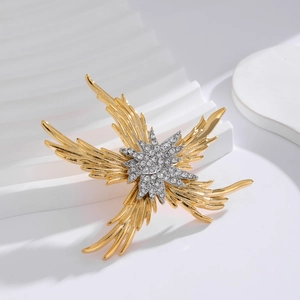 Luxury starfish brooch with gold feather rays and silver starburst pavé crystal detail