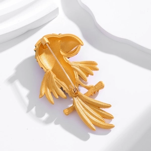 Back view of enamel parrot brooch in matte gold finish with secure needle pin clasp
