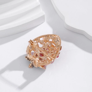 Elegant strawberry rhinestone brooch pin with gold alloy base and secure safety clasp