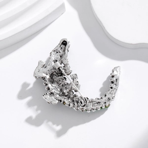 Silver retro crocodile brooch with green rhinestones and safety pin fastening