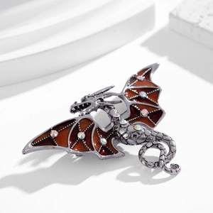 Spilla a drago in argento vintage con smalto ambrato e cristalli colorati scintillanti