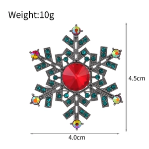 Snowflake brooch with red and green gemstones, size 4.5cm x 4.0cm, weight 10g