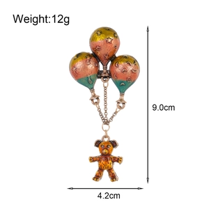 Vintage hot air balloon bear brooch with colorful gradient balloons and metal bear pendant
