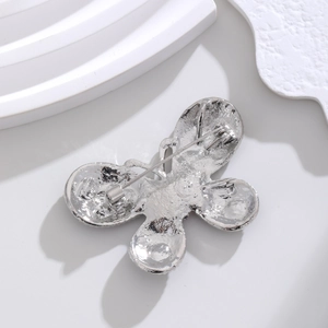 Exquisite silver alloy butterfly brooch with detailed textured back and secure pin clasp