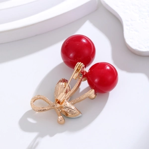 Sparkling crystal cherry brooch pin with red resin spheres and golden metal stem accents