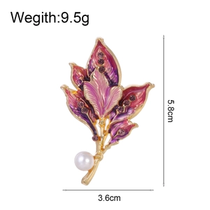 Elegant gold leaf brooch with purple enamel gradient, rhinestones and white pearl detail