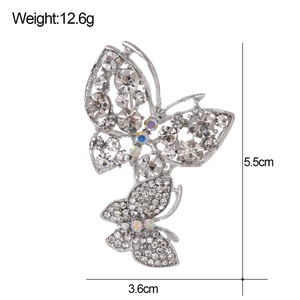 Elegant twin butterfly brooch with rhinestones measuring 5.5cm x 3.6cm and weighing 12.6g