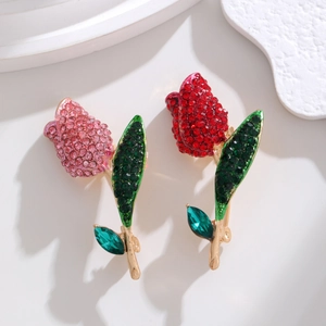 Elegant rose floral brooch with pink and red rhinestones and green crystal leaves