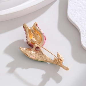 Back view of elegant tulip flower brooch with gold plating and long pin fastener