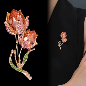 Elegant tulip brooch with amber crystals and pink rhinestones on a gold setting