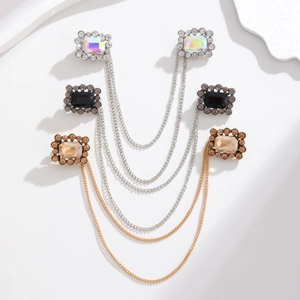 Detailed view of Baroque rhinestone double-head brooches with layered metal chains