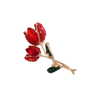 Elegant gold tulip brooch with sparkling red rhinestones and green crystal leaves